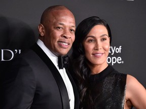 Dr. Dre (L) and Nicole Young attend the City of Hope Spirit of Life Gala 2018 at Barker Hangar on October 11, 2018 in Santa Monica, California.