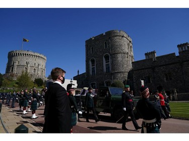 WINDSOR, ENGLAND - APRIL 17: The Land Rover Defender carrying the coffin of Prince Philip, Duke of Edinburgh is followed by members of the Royal family as it makes its way to St George's Chapel at Windsor Castle on April 17, 2021 in Windsor, England. Prince Philip of Greece and Denmark was born 10 June 1921, in Greece. He served in the British Royal Navy and fought in WWII. He married the then Princess Elizabeth on 20 November 1947 and was created Duke of Edinburgh, Earl of Merioneth, and Baron Greenwich by King VI. He served as Prince Consort to Queen Elizabeth II until his death on April 9 2021, months short of his 100th birthday. His funeral takes place today at Windsor Castle with only 30 guests invited due to Coronavirus pandemic restrictions.