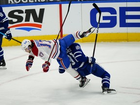 Toronto Maple Leafs forward John Tavares  and Montreal Canadiens forward Josh Anderson collide during a game earlier this season.