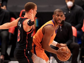 Raptors rookie guard Malachi Flynn, here guarding Chris Paul of the Phoenix Suns on March 26, 2021 should be getting more floor time with the team fading from the playoff picture.