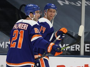 Kyle Palmieri and Travis Zajac of the skate during warmups prior to their Islanders debut game against the Philadelphia Flyers  at Nassau Coliseum on April 08, 2021.