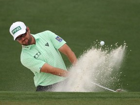 Corey Conners of Canada plays a shot from a bunker on the second hole during the third round of the Masters at Augusta National Golf Club on April 10, 2021 in Augusta, Georgia.
