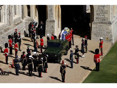 The Duke of Edinburgh's coffin, covered with His Royal Highness's Personal Standard is carried to the purpose built Land Rover during the funeral of Prince Philip, Duke of Edinburgh at Windsor Castle on April 17, 2021 in Windsor, England.