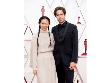 LOS ANGELES, CALIFORNIA – APRIL 25: (EDITORIAL USE ONLY) In this handout photo provided by A.M.P.A.S., (L-R) Chloé Zhao and Joshua James Richards attend the 93rd Annual Academy Awards at Union Station on April 25, 2021 in Los Angeles, California.