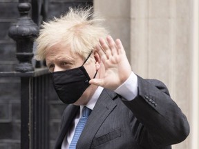 British Prime Minister Boris Johnson leaves 10 Downing Street to attend the weekly PMQ's April 28, 2021 in London, England.