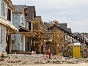 This 2018 photo,  shows homes under construction in Brantford, Ont.
