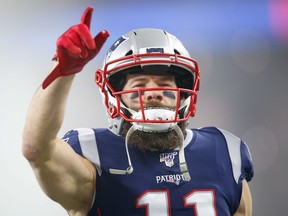 New England Patriots wide receiver Julian Edelman points to the crowd before a game against the Tennessee Titans.