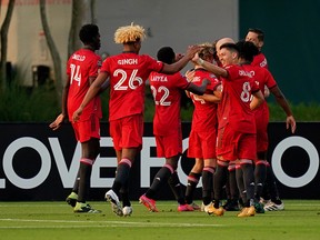 Toronto FC players celebrate the goal scored by forward Patrick Mullins (13) during Wednesday's game against Club Leon.