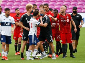 Vancouver Whitecaps midfielder Russell Teibert (31) and Toronto FC midfielder Michael Bradley (4) have words after their 2-2 draw on Saturday.