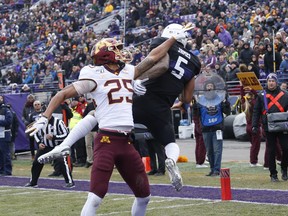 Benjamin St-Juste #25 of the Minnesota Golden Gophers defends a pass.