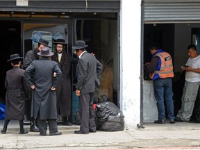 Members ultra-Orthodox Lev Tahor Jewish group are seen at the entrance of a building in Guatemala City, where the group has been residing.