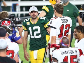 Buccaneers quarterback Tom Brady (right) greets Green Bay Packers quarterback Aaron Rodgers (left) after a NFL game at Raymond James Stadium.