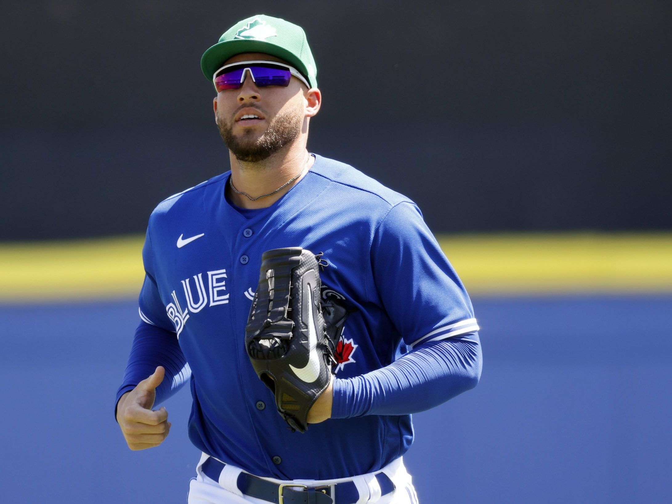 George Springer of the Toronto Blue Jays looks on from the dugout