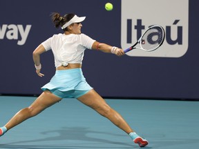 Bianca Andreescu of Canada hits a backhand against Sara Sorribes Tormo of Spain in a women's singles quarterfinal in the Miami Open at Hard Rock Stadium.