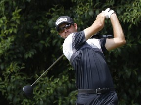 Canada’s Corey Conners hits his tee shot on the 14th hole during the first round at the Masters yesterday. Conners finished the day at one-over par.