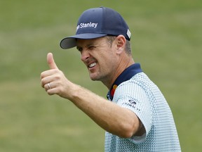 England's Justin Rose acknowledges the crowd on the 18th green after completing his second round at the Masters. Rose has the lead heading into the third round.