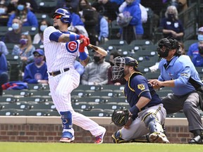 Chicago Cubs' Javier Baez blasts his sixth homer of the season  against the Milwaukee Brewers at Wrigley Field pm Friday.