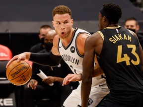 Brooklyn Nets forward Blake Griffin (L) dribbles the ball while defended by Toronto Raptors forward Pascal Siakam (43) during the second quarter at Amalie Arena on Tuesday night.