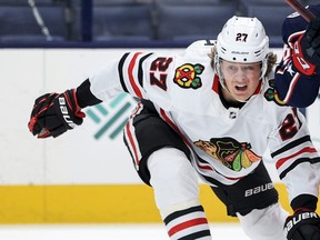 Chicago Blackhawks defenseman Adam Boqvist battles for the puck against the Columbus Blue Jackets in the first period at Nationwide Arena in Columbus, Ohio, April 10, 2021.
