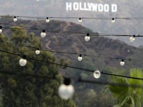 In this file photo, the Hollywood sign is seen in the background of decoration lights at Hollywood/Highland shopping centre on March 1, 2014 in Hollywood, Calif.