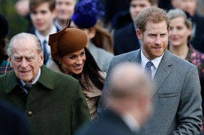 (L-R) Britain’s Prince Philip, Duke of Edinburgh, US actress and fiancee of Britain’s Prince Harry Meghan Markle and Britain’s Prince Harry (R) arrive to attend the Royal Family’s traditional Christmas Day church service at St Mary Magdalene Church in Sandringham, Norfolk, eastern England, on December 25, 2017. / AFP PHOTO / Adrian DENNISADRIAN DENNIS/AFP/Getty Images