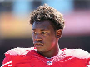 Linebacker Aldon Smith of the San Francisco 49ers looks on against the Green Bay Packers at Candlestick Park on September 8, 2013 in San Francisco.