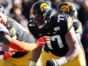 Offensive tackle Alaric Jackson, from Windsor, Ont., is shown here in action for the University of Iowa Hawkeyes. A four-year starter, the hulking lineman maintains that he is more of an athlete than people give him credit for.