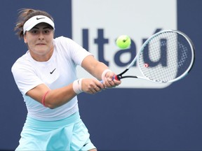 Bianca Andreescu of Canada hits a backhand during her match against Ashleigh Barty of Australia in the women's singles final in the Miami Open at Hard Rock Stadium in Miami.
