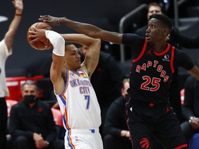 Toronto Raptors forward Chris Boucher defends Oklahoma City Thunder forward Darius Bazley.