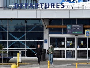 Passengers arrive at the B.C. Ferries terminal as new non-essential travel restrictions between provincial health authority regions were announced, in order to help limit the spread of COVID-19, in Tsawwassen, B.C., April 23, 2021.