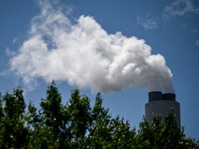 Steam rises from the Miller coal Power Plant in Adamsville, Alabama on April 11, 2021.