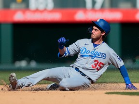 Los Angeles Dodgers centre fielder Cody Bellinger slides safely into second during a game against the Colorado Rockies at Coors Field.