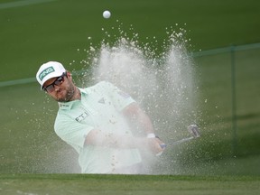 Canada's Corey Conners plays out from the bunker onto the second green during the third round of The Masters at Augusta, Ga., on Saturday, April 10. BRIAN SNYDER/REUTERS