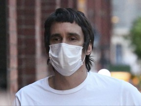 Richard Pusey walks on a Melbourne, Australia street on Oct. 16, 2020, after he was granted bail.