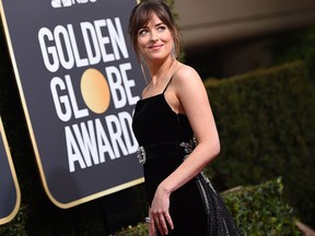 Actress Dakota Johnson arrives for the 75th Golden Globe Awards on January 7, 2018, in Beverly Hills, Calif.