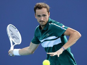 Daniil Medvedev returns a shot to Frances Tiafoe during the Miami Open at Hard Rock Stadium in Miami Gardens, Fla., March 30, 2021.