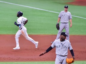 Randy Arozarena, top left, of the Tampa Bay Rays runs the bases after hitting a home run off of Domingo German, bottom right, of the New York Yankees in the third inning at Tropicana Field on April 10, 2021 in St. Petersburg, Fla.