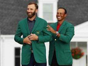 Dustin Johnson and Tiger Woods (Patrick Smith/Getty Images)