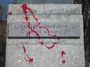 Red paint defaces the statue of Halifax city founder Edward Cornwallis in Halifax, May 13, 2016.