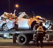 The aftermath of a vehicle being hit by a falling overhead road sign on the QEW in Burlington on Tuesday, April 27, 2021.