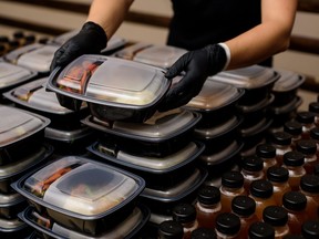 Lunch box with food in the hands. Catering.