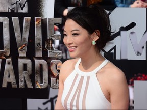 Actress Arden Cho arrives on the red carpet for the 2014 MTV Movie Awards at the Nokia Theater in Los Angeles, California, on April 13, 2014.