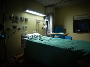 An empty hospital room is ready for the next patient.