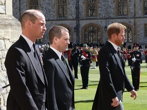 Prince Harry, Duke of Sussex (foreground), and other Royals, follow Prince Philip, Duke of Edinburgh's coffin during the Ceremonial Procession during the funeral of Prince Philip, Duke of Edinburgh at Windsor Castle on April 17, 2021 in Windsor, England.