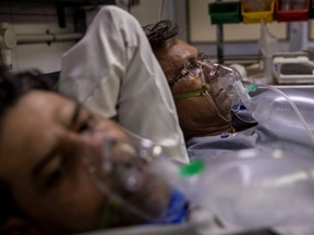 Patients suffering from COVID-19 get treatment at the casualty ward in Lok Nayak Jai Prakash (LNJP) hospital, amidst the spread of the disease in New Delhi, India, Thursday, April 15, 2021.