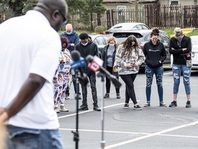 Groups of mourners and gun violence advocates bow their heads and weep as they gather for a prayer vigil at Olivet Missionary Baptist Church April 17, 2021 in Indianapolis, Indiana.