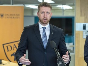 Premier Iain Rankin fields question after touring a lab at Dalhousie University in Halifax, March 29, 2021.