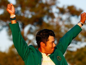 Hideki Matsuyama of Japan celebrates during the green jacket ceremony after winning the Masters at Augusta National Golf Club on April 11, 2021 in Augusta, Ga.