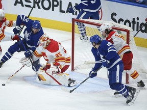 Calgary Flames goalie Jacob Markstrom makes a save on Maple Leafs' Alex Galchenyuk during the second period in Toronto on Tuesday, April 13, 2021.