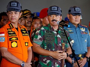 Indonesia's military chief Hadi Tjahjanto talks to journalists during a press conference with Head of Indonesian Search and Rescue Agency Muhammad Syaugi (L) at Tanjung Priok port in Jakarta, Indonesia, October 31, 2018.